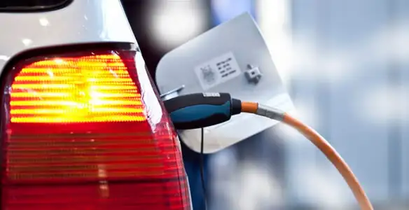 Electric car plugged into EV charger after professional installation in San Antonio, TX