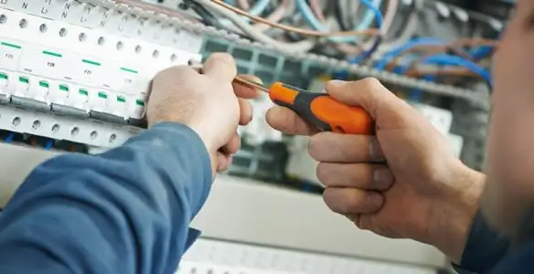 electrical service showing licensed electrician performing electrical panel maintenance and adjustments in San Antonio, TX