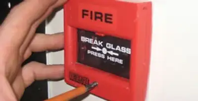 fire alarm installation service showing manual fire alarm pull station installed by licensed electricians in San Antonio, TX