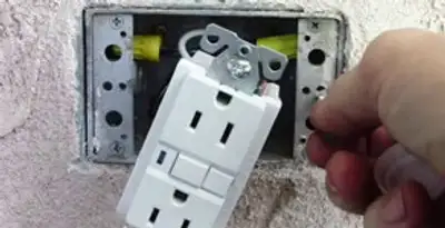 gfci circuits service showing installation of a ground fault circuit interrupter outlet by licensed electricians in San Antonio, TX
