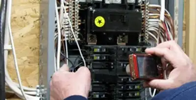 Home electrical inspection of circuit breaker panel by licensed electrician in San Antonio, TX