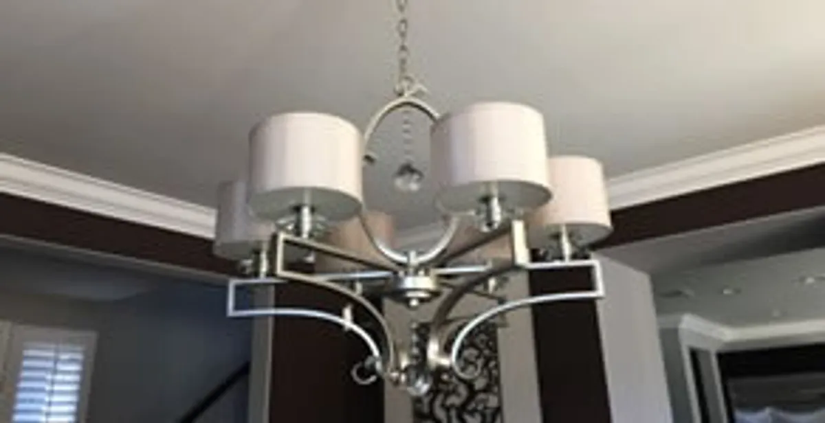 Modern chandelier installation with multiple light fixtures in San Antonio, TX