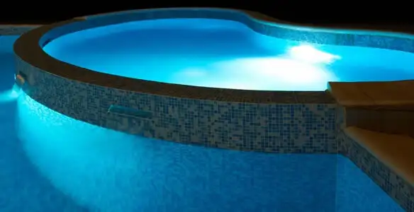 pool light installation and repair services highlighting illuminated pool interior lighting in San Antonio, TX
