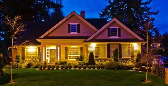 security light installation services illuminating a residential exterior at night in San Antonio, TX