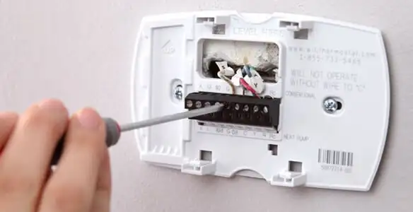Thermostat installation service with proper wiring and secure wall mounting in San Antonio, TX